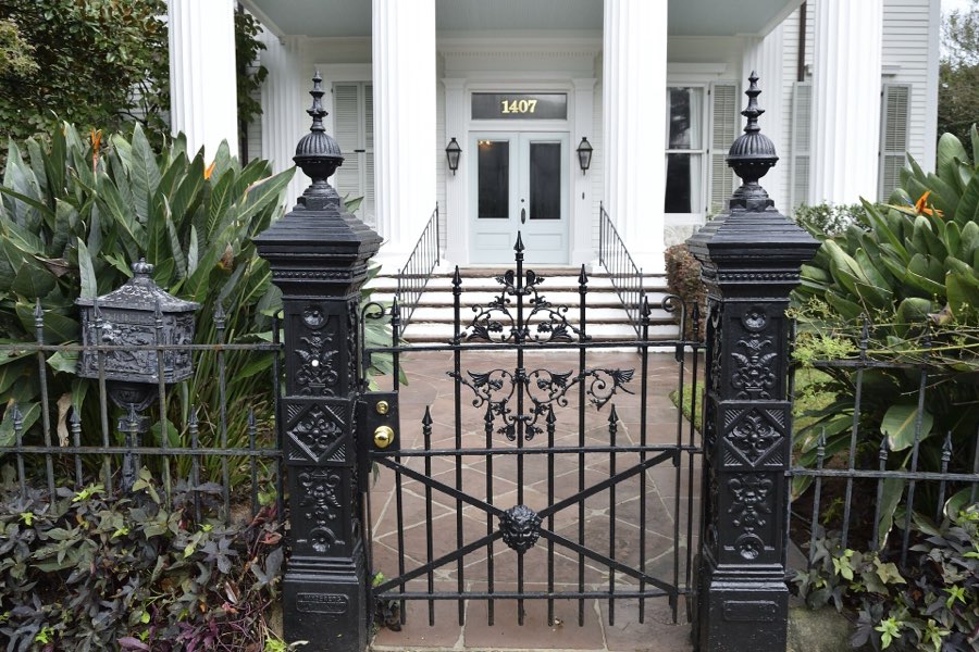 Ironwork gate before a Garden District mansion