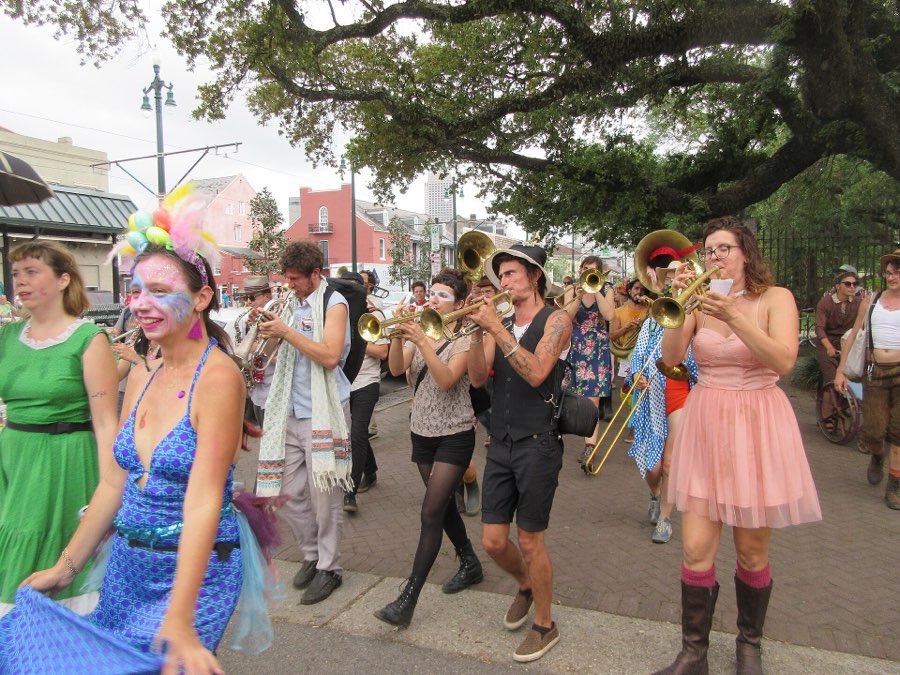 Brass band parade under live oaks